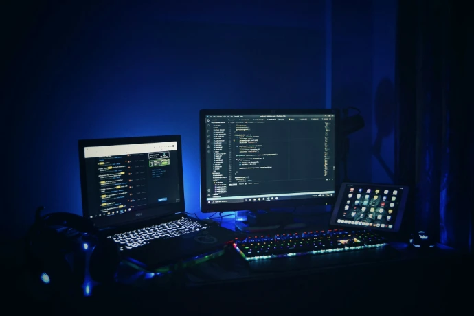 black laptop computer turned on beside black computer keyboard